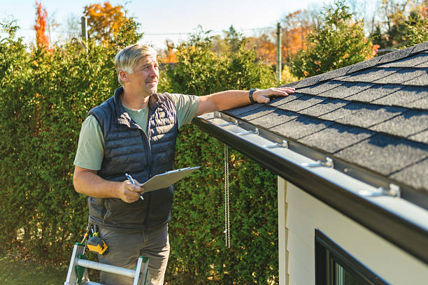 Professional Roofing technician working in Durango, IA